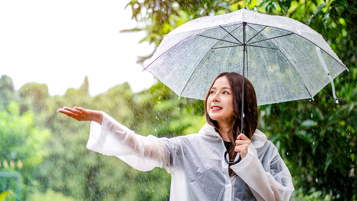 Woman holding an umbrella in the rain.