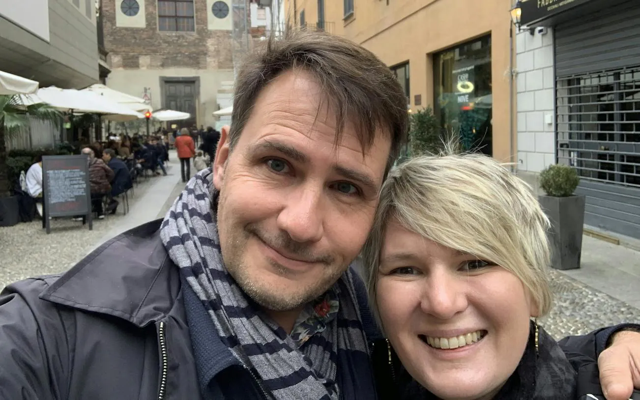 Couple exploring Milan's Brera district during self-guided city game.