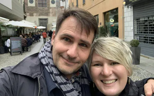 Couple exploring Milan's Brera district during self-guided city game.