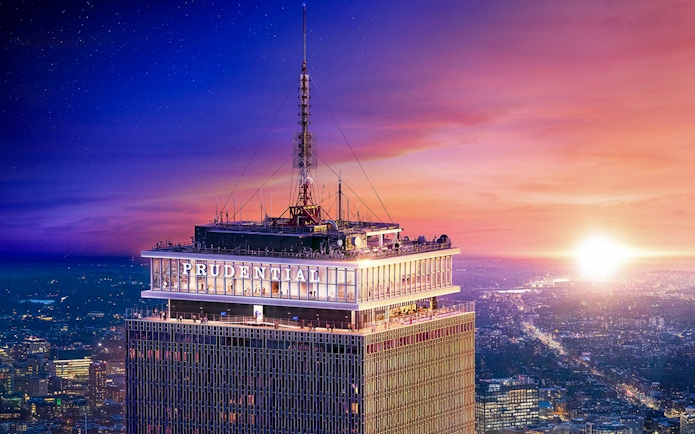 Prudential Tower in Boston at sunset with cityscape view.