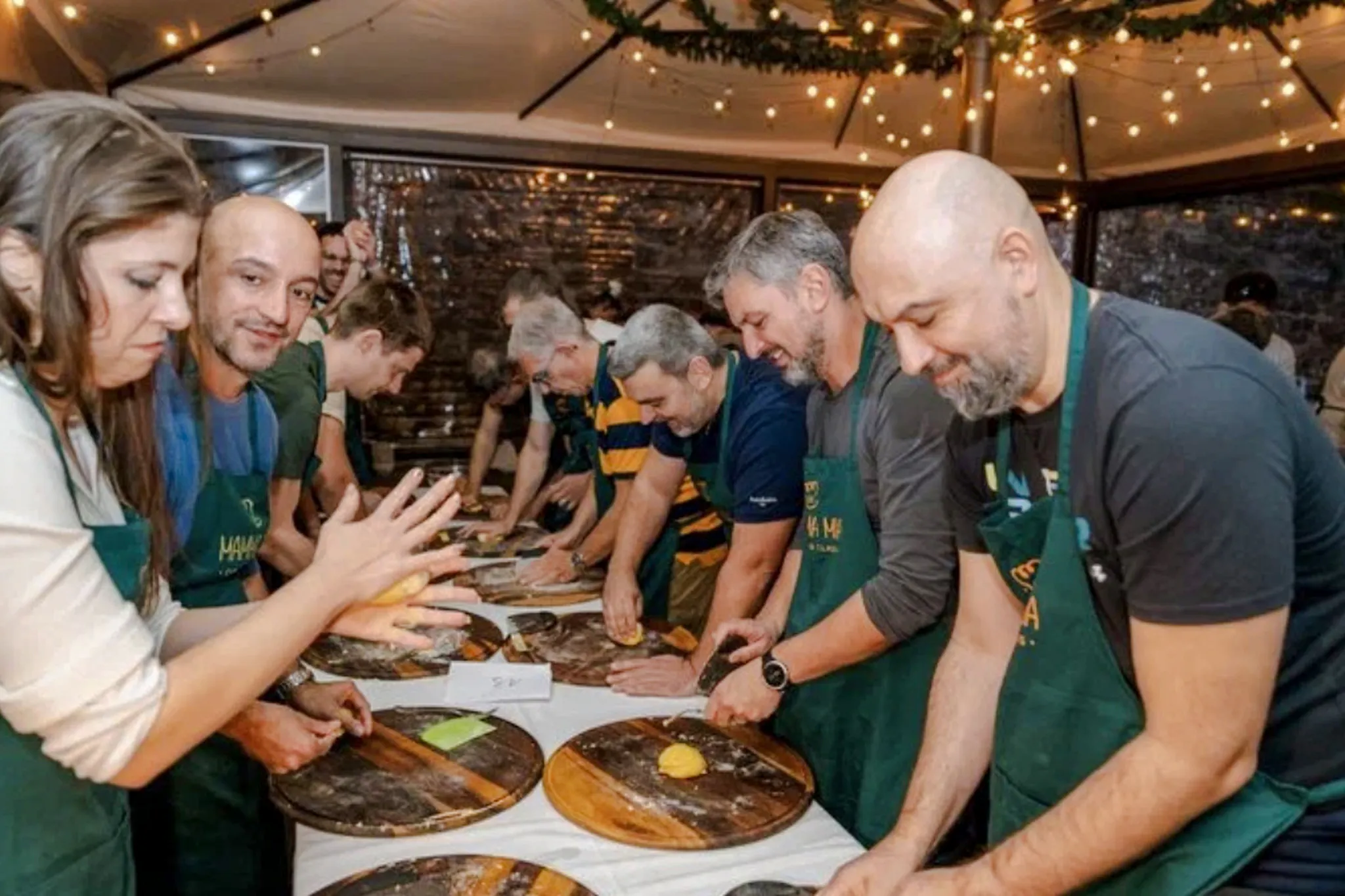 People making pasta during a cooking class in Florence.