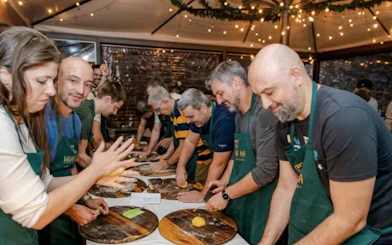 People making pasta during a cooking class in Florence.