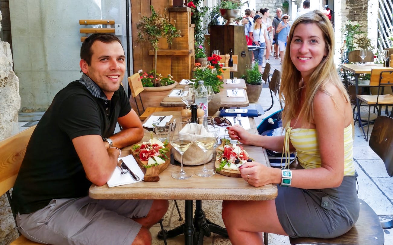 Guests enjoying wine tasting at a cafe in Diocletian’s Palace, Split.