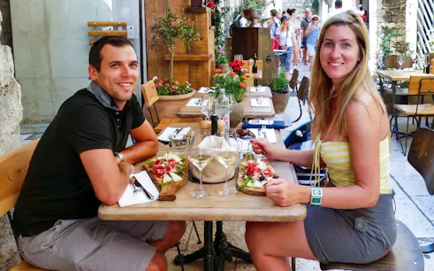 Guests enjoying wine tasting at a cafe in Diocletian’s Palace, Split.