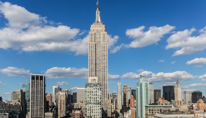 Empire State Building, New York City skyline in background.