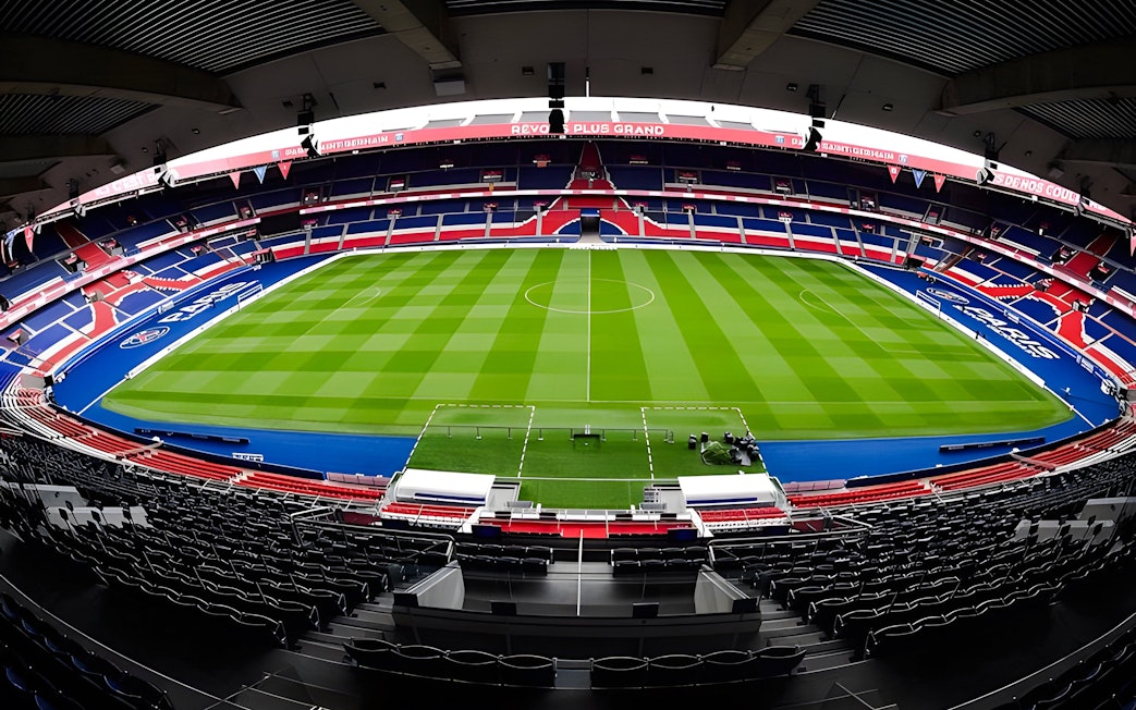 PSG Stadium in Paris, France, empty with a view of the field and seating.