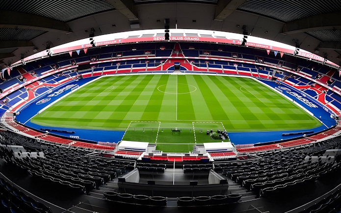 PSG Stadium in Paris, France, empty with a view of the field and seating.