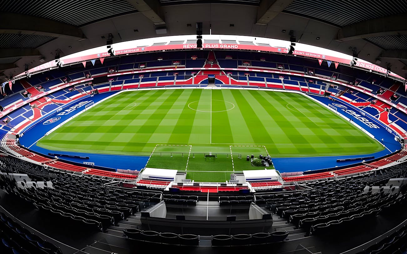 PSG Stadium in Paris, France, empty with a view of the field and seating.
