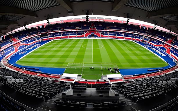 PSG Stadium in Paris, France, empty with a view of the field and seating.