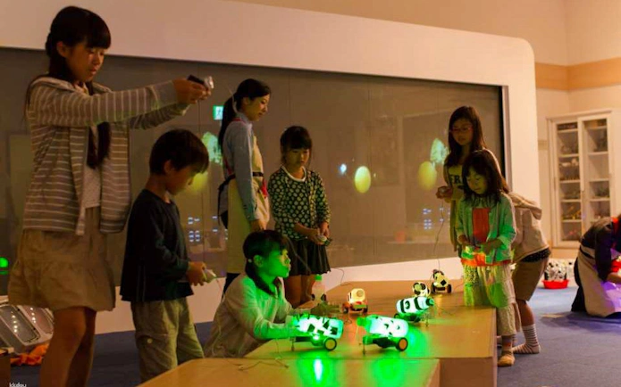Children engaging with interactive exhibits at Kids Plaza Osaka.