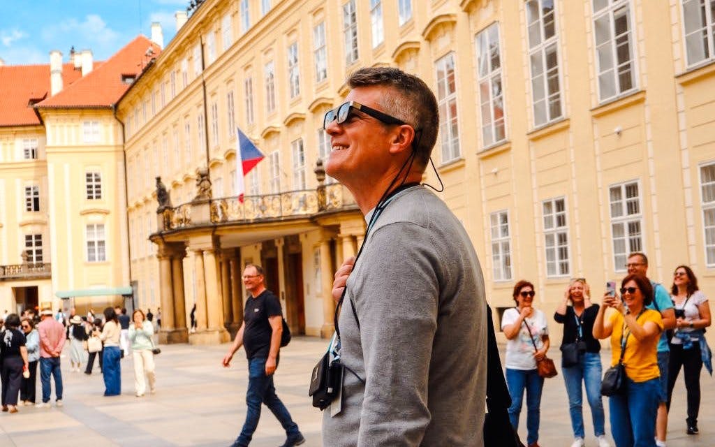Guests using AR glasses on Prague Castle Time Travel Tour.