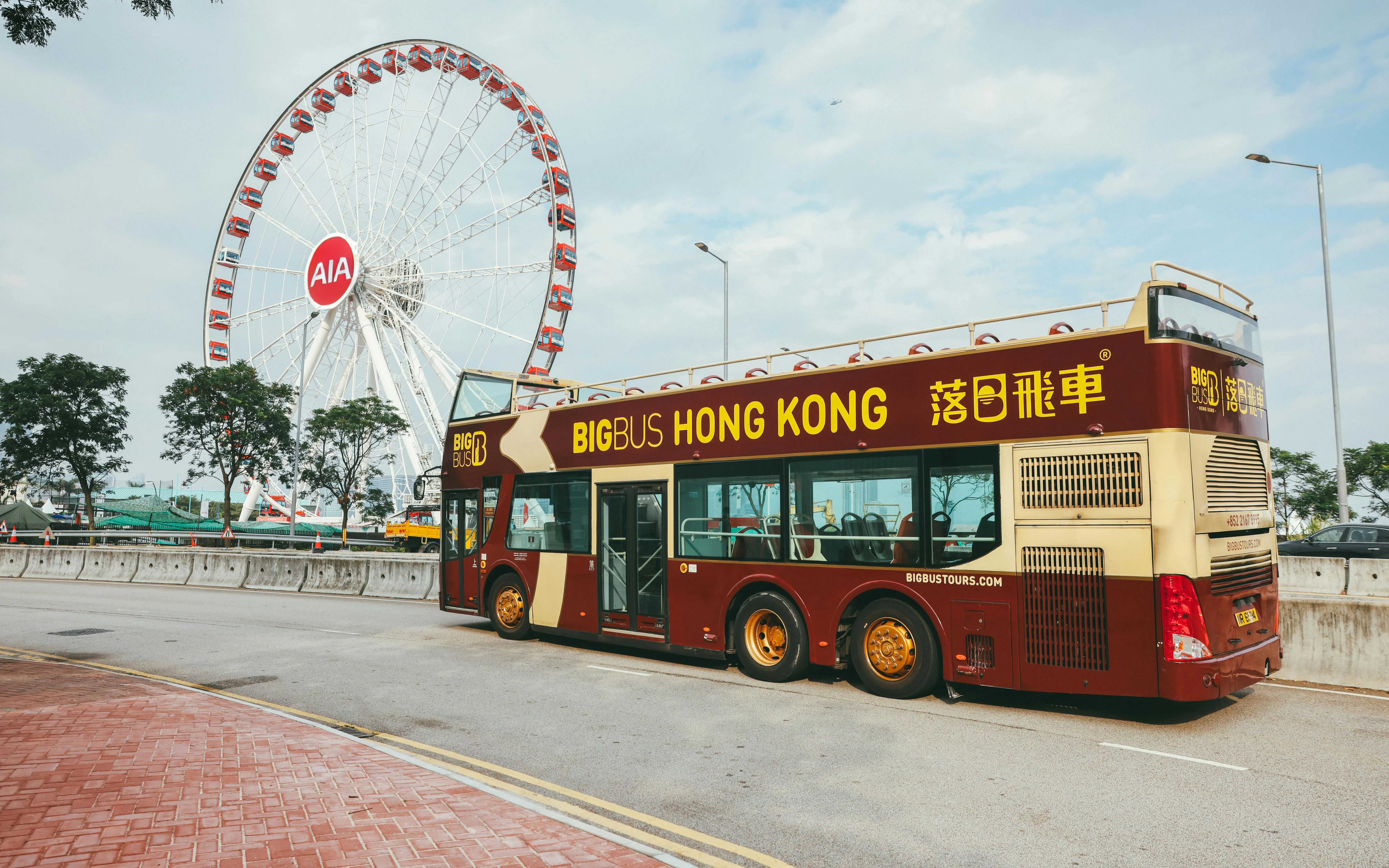 Hop-on hop-off bus near Hong Kong Observation Wheel on Victoria Harbor tour.