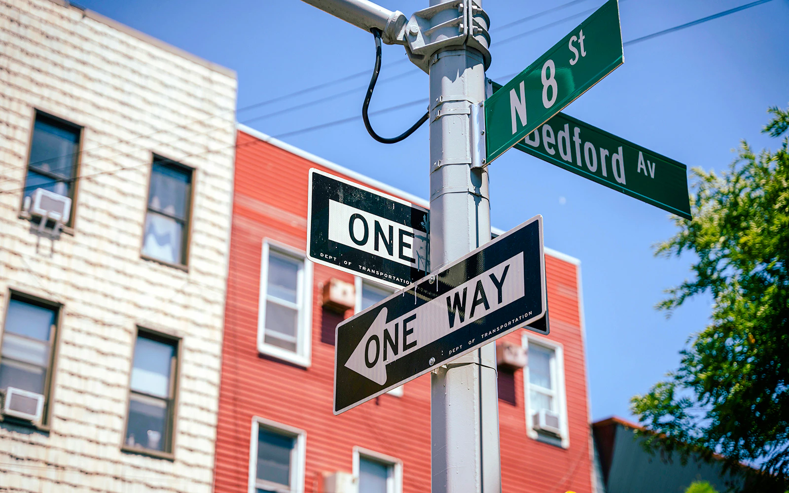 Street signs at Bedford Ave and N 8th St intersection in NYC.