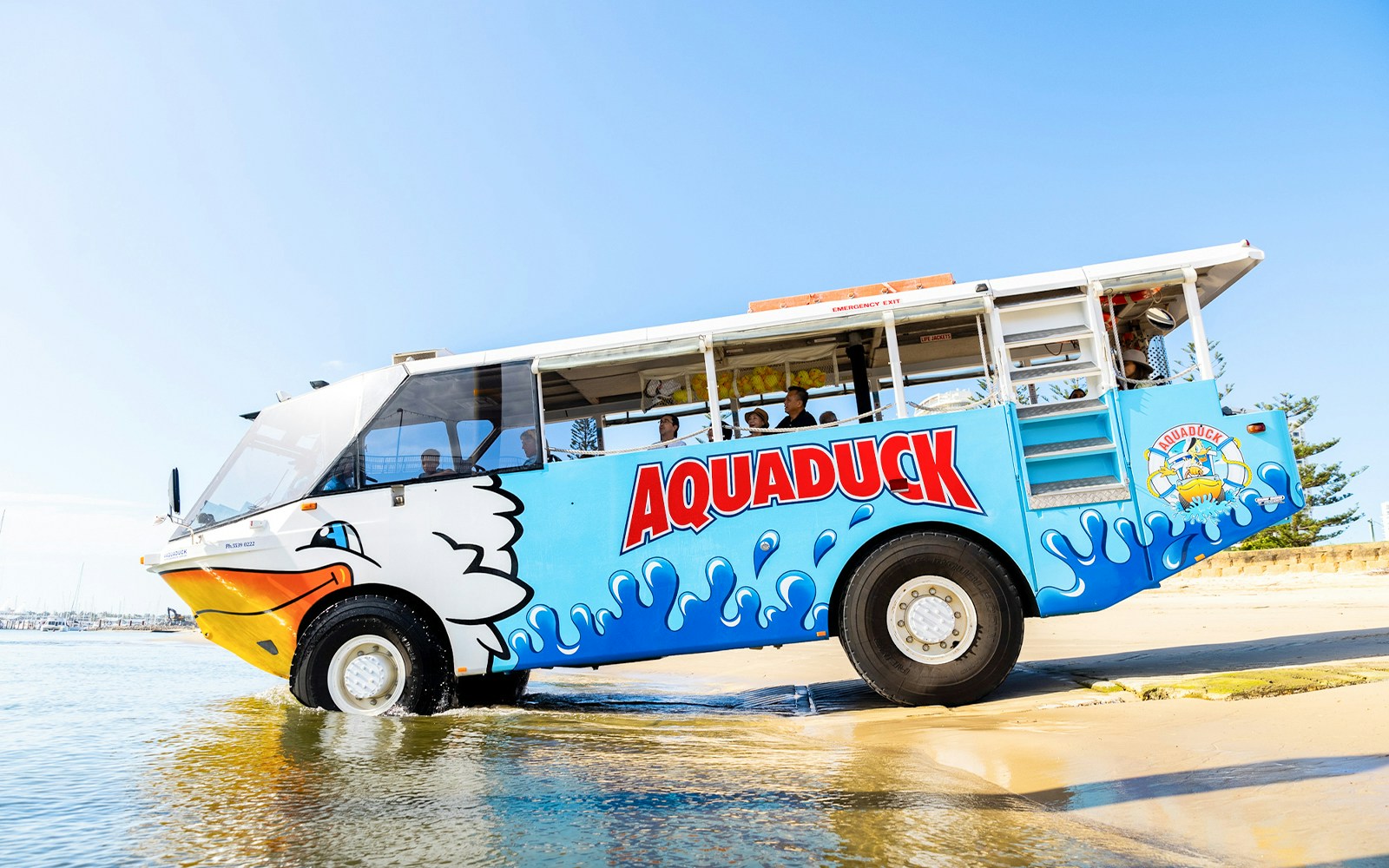Aquaduck amphibious vehicle entering water for city tour and river cruise.