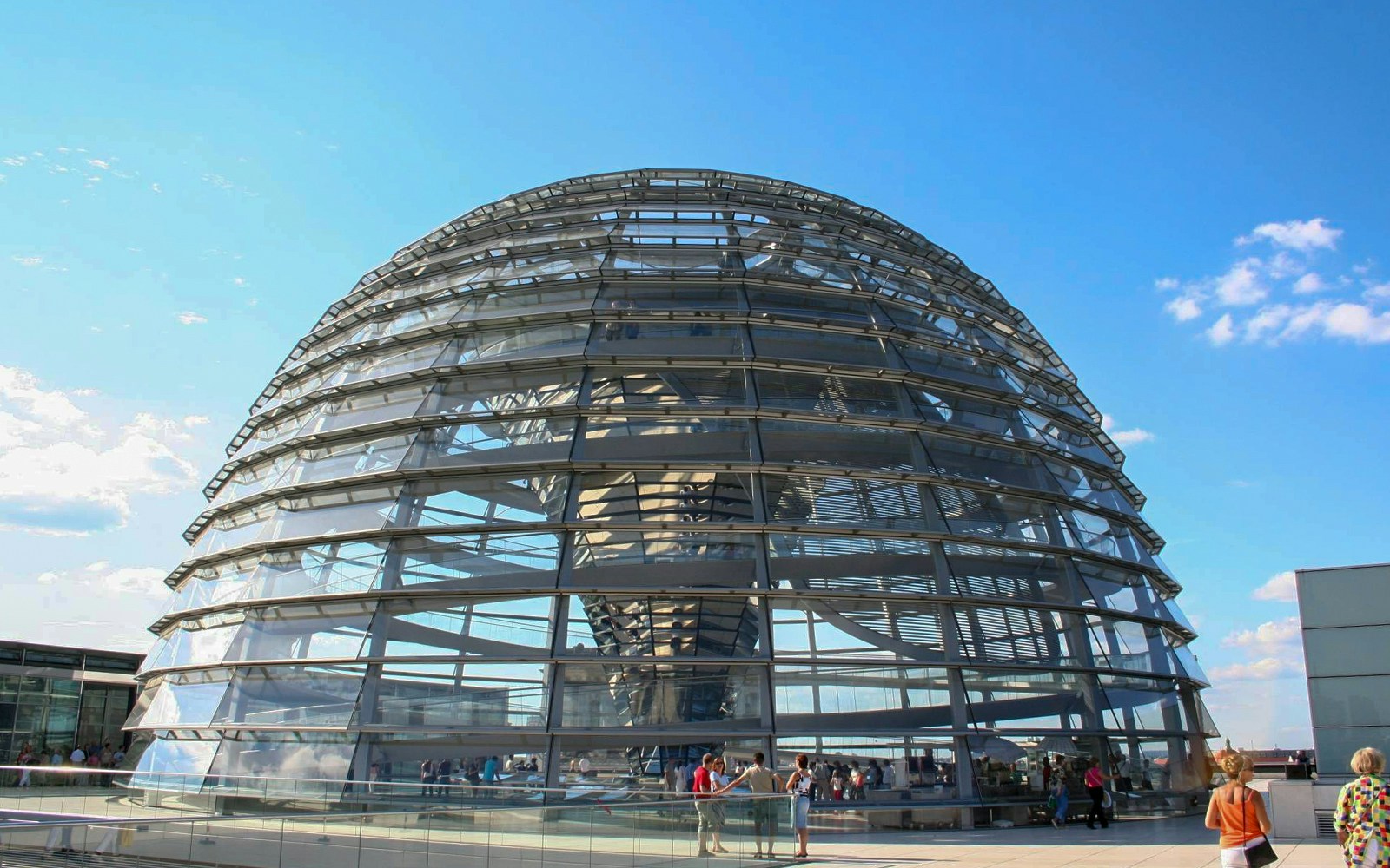 Reichstag dome in Berlin with visitors on the rooftop terrace.
