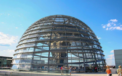 Reichstag dome in Berlin with visitors on the rooftop terrace.
