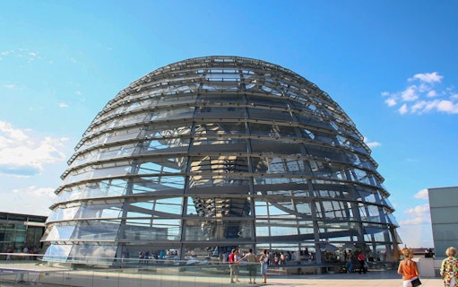 Reichstag dome in Berlin with visitors on the rooftop terrace.