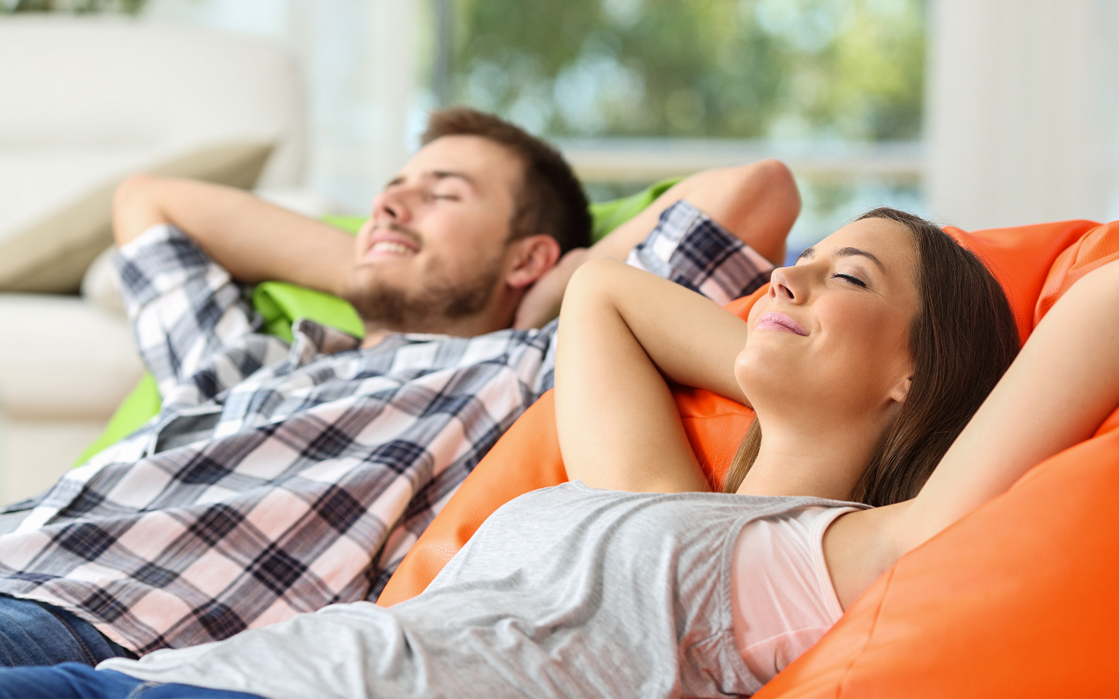 parents of kids relaxing on couch at kidzania dubai