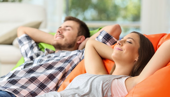 parents of kids relaxing on couch at kidzania dubai