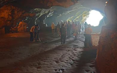 Visitors exploring Hercules Cave in Tangier, Morocco.