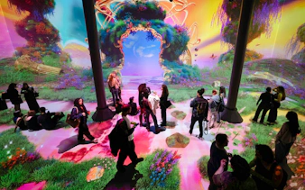 Guests exploring immersive digital art exhibits at ARTECHOUSE DC.