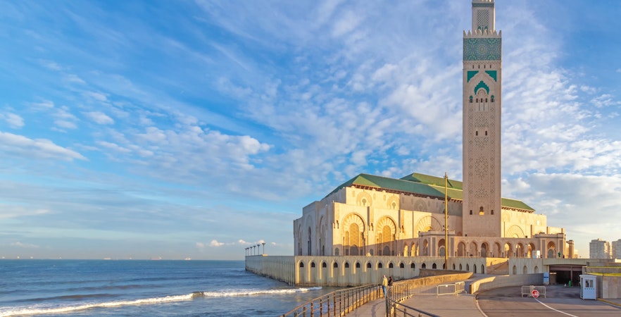 Hassan II Mosque in Casablanca with ocean view and promenade.