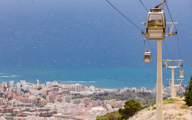 Benalmádena cable car overlooking cityscape and Mediterranean Sea.