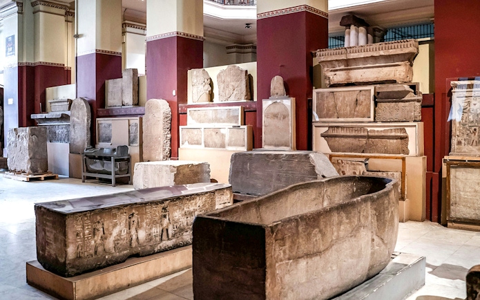 Ancient Egyptian artifacts displayed in the Grand Egyptian Museum.