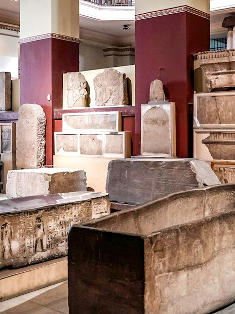 Ancient Egyptian artifacts displayed in the Grand Egyptian Museum.