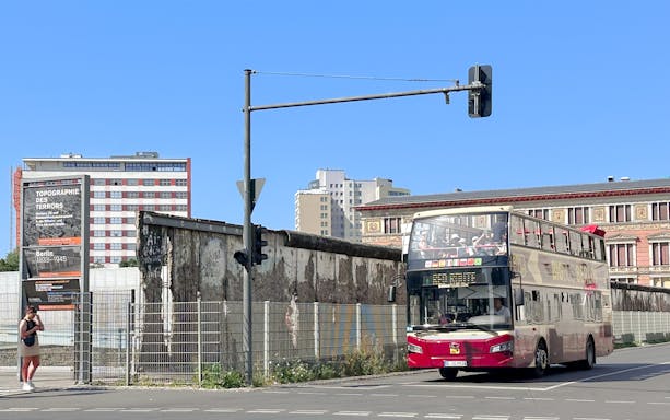 Hop-on hop-off bus near Berlin Wall and Topography of Terror exhibit.
