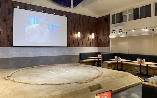 Sumo ring in Tokyo restaurant with seating for Chanko Nabe lunch experience.