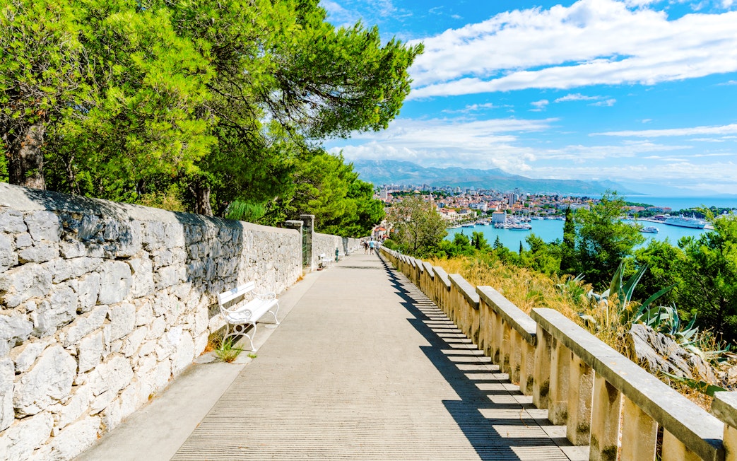 Pathway on Marjan Hill overlooking Split, Croatia with city and sea views.