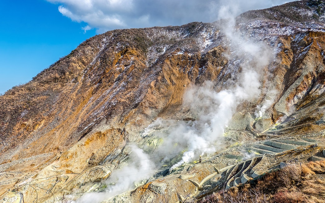 Volcanic steam vents at Owakudani Valley on Mt Fuji tour from Tokyo.