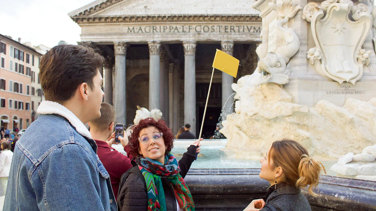 Tour guide leading a group at the Pantheon in Rome.