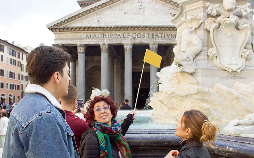 Tour guide leading a group at the Pantheon in Rome.