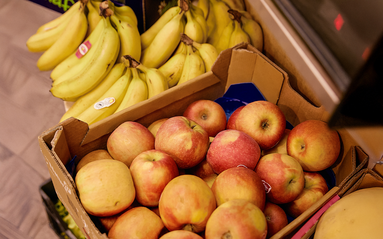 Apples and bananas displayed at Florence market food tour.