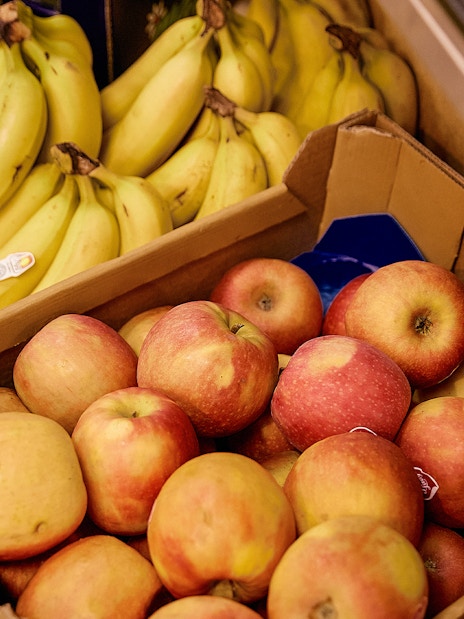 Apples and bananas displayed at Florence market food tour.
