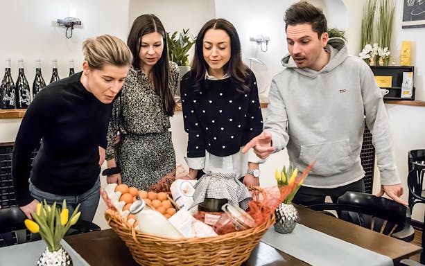 Participants examining ingredients for Kaiserschmarrn cooking class.