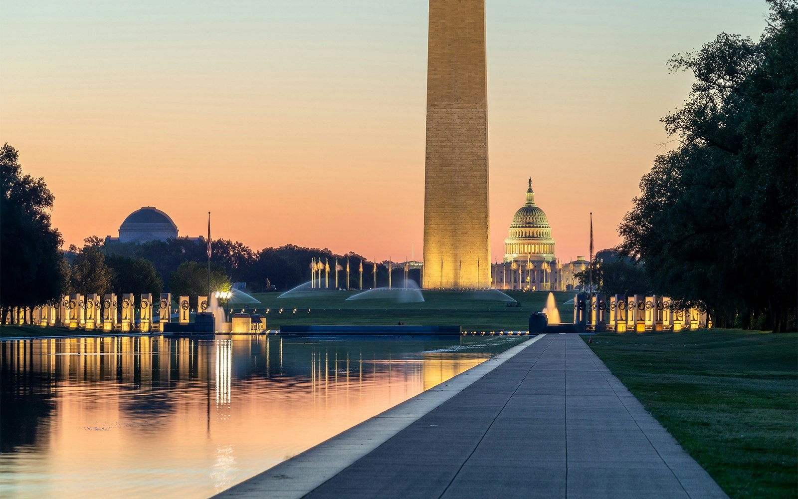 Washington Monument, WW2 Memorial, and Capitol Building at sunset in Washington, DC.