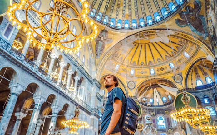 Tourist admiring the interior of Hagia Sophia, Istanbul.