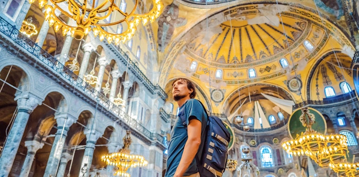 Tourist admiring the interior of Hagia Sophia, Istanbul.