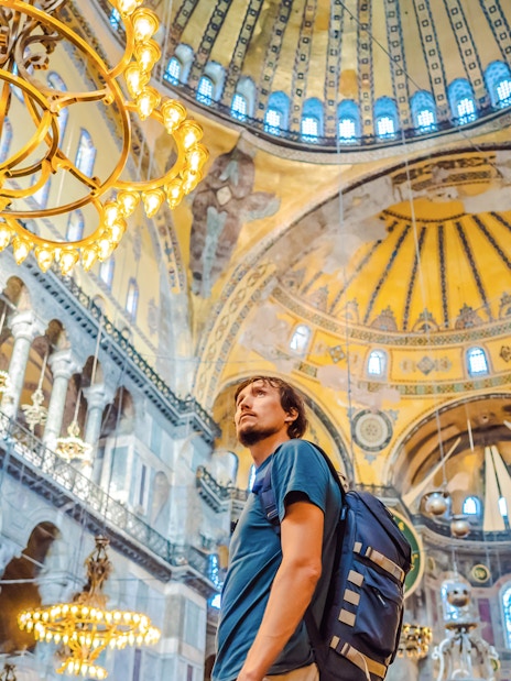 Tourist admiring the interior of Hagia Sophia, Istanbul.