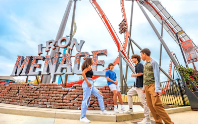 Visitors at Iron Menace roller coaster entrance, Dorney Park, Six Flags.