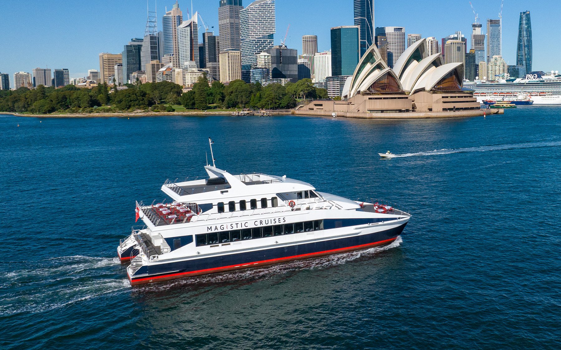 Cruise ship near Sydney Opera House on Sydney Harbour sightseeing tour.