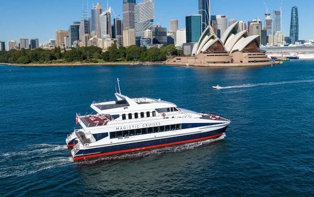 Cruise ship near Sydney Opera House on Sydney Harbour sightseeing tour.