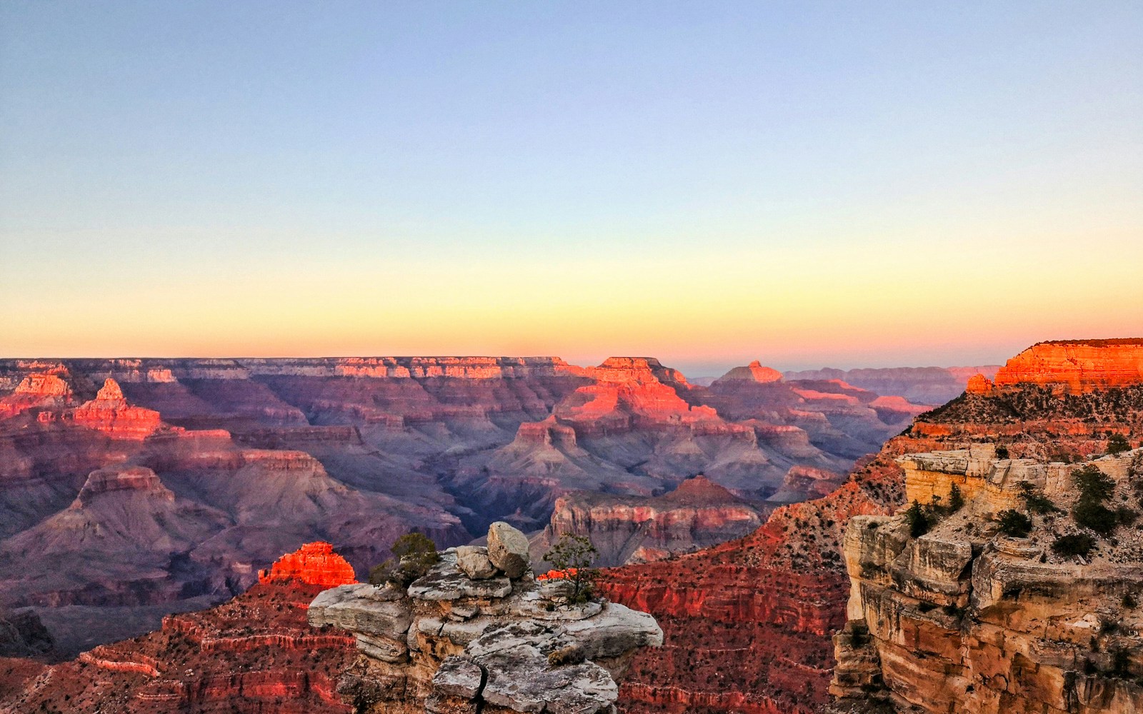 Grand Canyon South Rim at sunset, view from airplane tour.