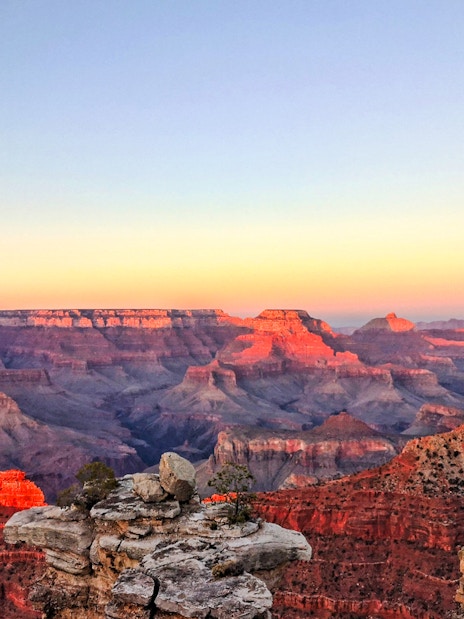 Grand Canyon South Rim at sunset, view from airplane tour.