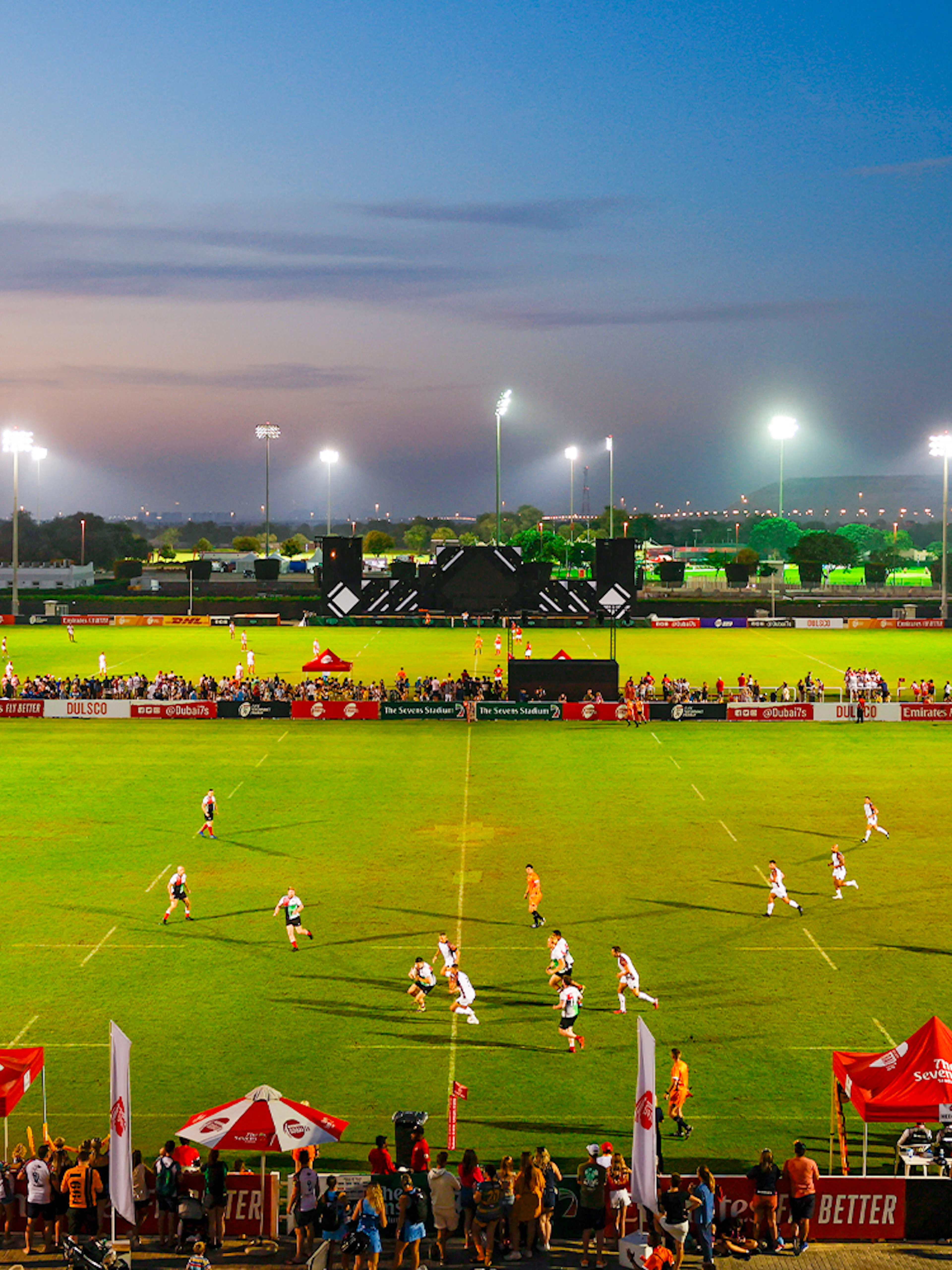 Rugby match at Emirates Dubai 7s stadium during evening, Dubai, UAE.