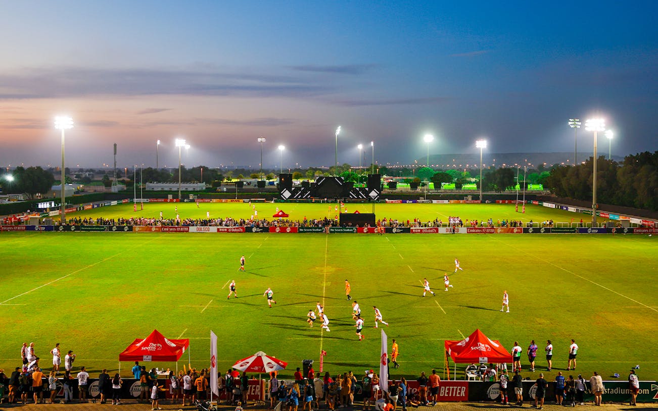 Rugby match at Emirates Dubai 7s stadium during evening, Dubai, UAE.