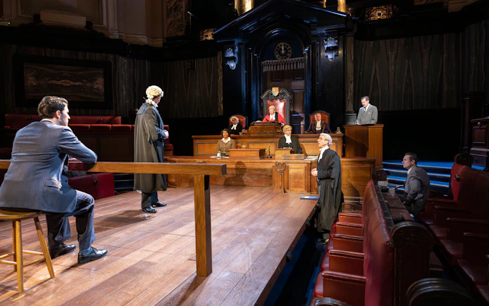 Courtroom scene from "Witness for the Prosecution" performance with actors in legal attire.